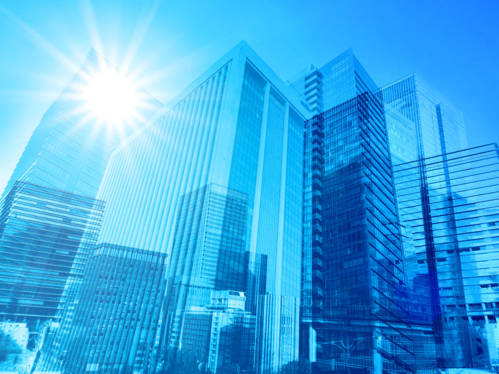 夏の太陽光と青いビジネス街の抽象背景素材