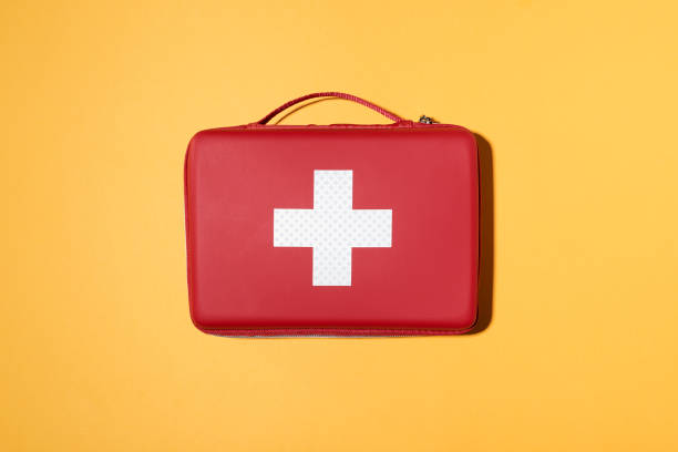 Red Bag with White Cross and Handle on Yellow Solid Background