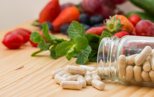 Vitamins,Supplements,In,The,Bottle,And,Wooden,Table.