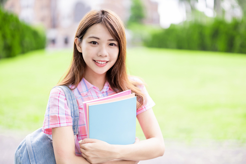 Asian,College,Student,Smile,To,You,With,Books,Holding,In