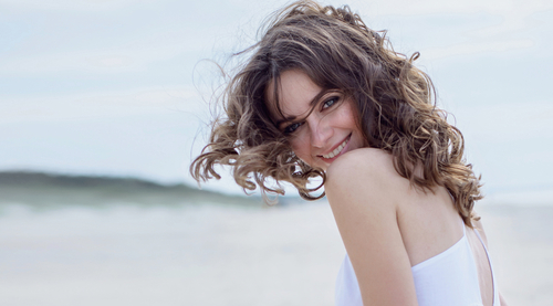 Happy,Woman,On,The,Beach.,Portrait,Of,The,Beautiful,Girl
