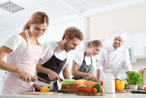 Group,Of,People,And,Male,Chef,At,Cooking,Classes