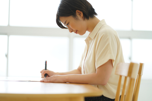 A,Woman,Practicing,Ballpoint,Pen,Writing