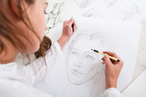 Artist,Drawing,Pencil,Portrait,Close-up.,Woman,Painter,Creating,Picture,Of