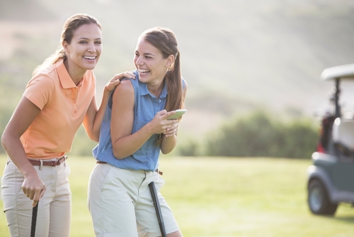 Women,Laughing,On,Golf,Course