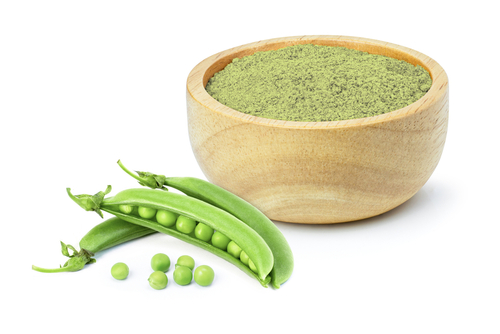 Green,Pea,Protein,Powder,In,Wooden,Bowl,And,Fresh,Green