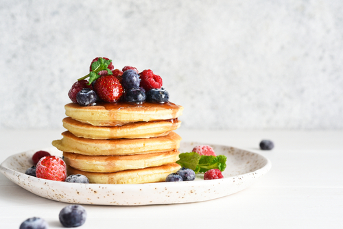 Pancakes,With,Berries,And,Maple,Syrup,For,Breakfast,On,A