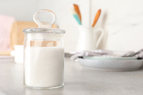 Jar,With,White,Sugar,On,Grey,Table