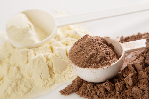 Close,Up,Of,Protein,Powder,And,Scoops