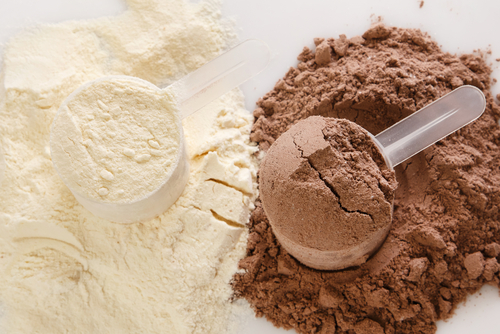 Close,Up,Of,Protein,Powder,And,Scoops