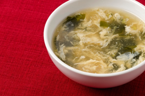 Wakame,Seaweed,Egg,Drop,Soup,In,White,Bowl,On,Red