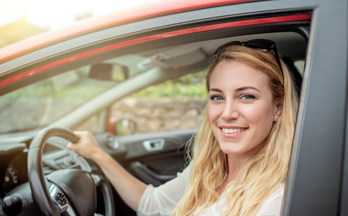 Happy,Beautiful,Woman,Is,Driving,A,Red,Car.