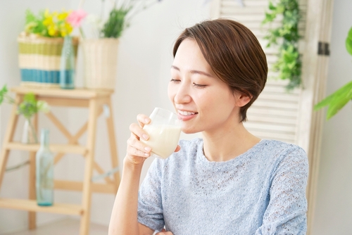 Asian,Woman,Drinking,Soy,Milk,At,Home