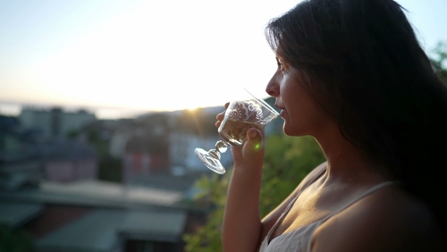 Woman,Drinking,White,Wine,Outside,During,Sunset,Time.,Female,Person