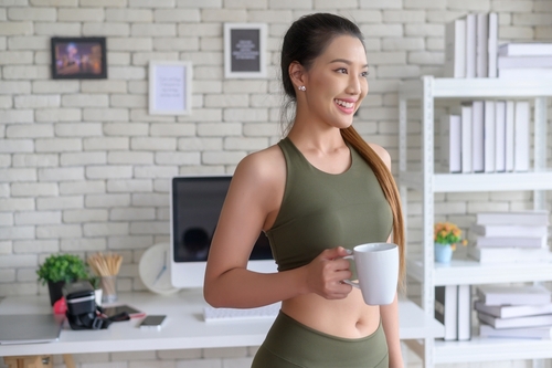 Young,Fitness,Woman,In,Sportswear,Having,A,Cup,Of,Coffee