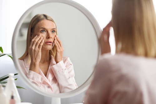 Skin,Problems,Concept.,Upset,Middle,Aged,Woman,Looking,At,Mirror